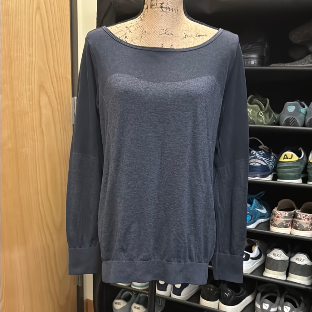 Like new NIKE blue gray, long sleeved active top. Very minimally sheer. Size L.